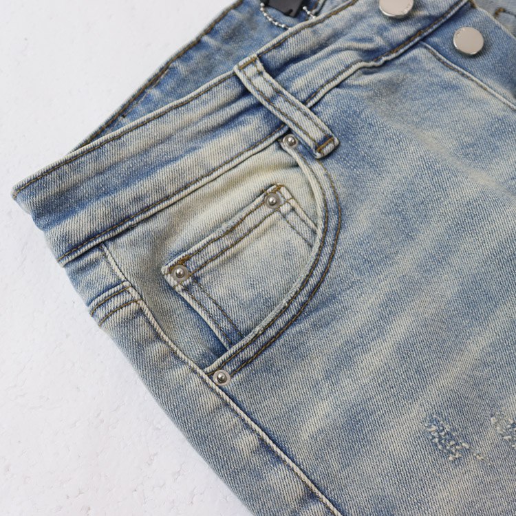 AMIRI's popular bone-embroidered washed denim jeans -4